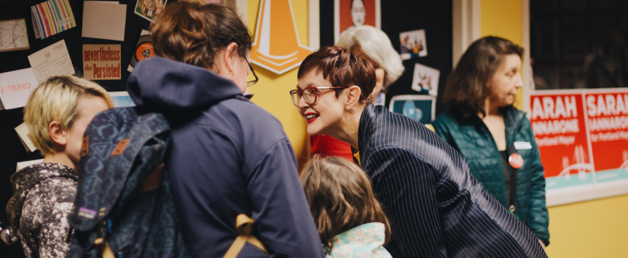 Sarah talking to people at the campaign kickoff